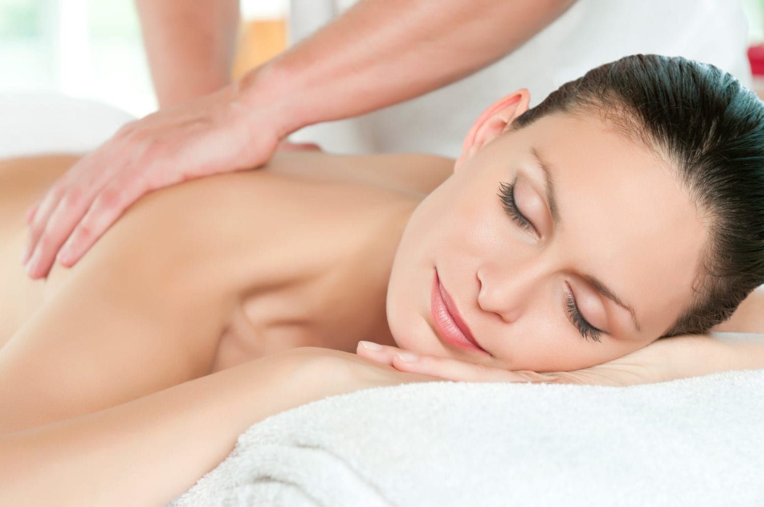 A woman is getting a massage at a spa.