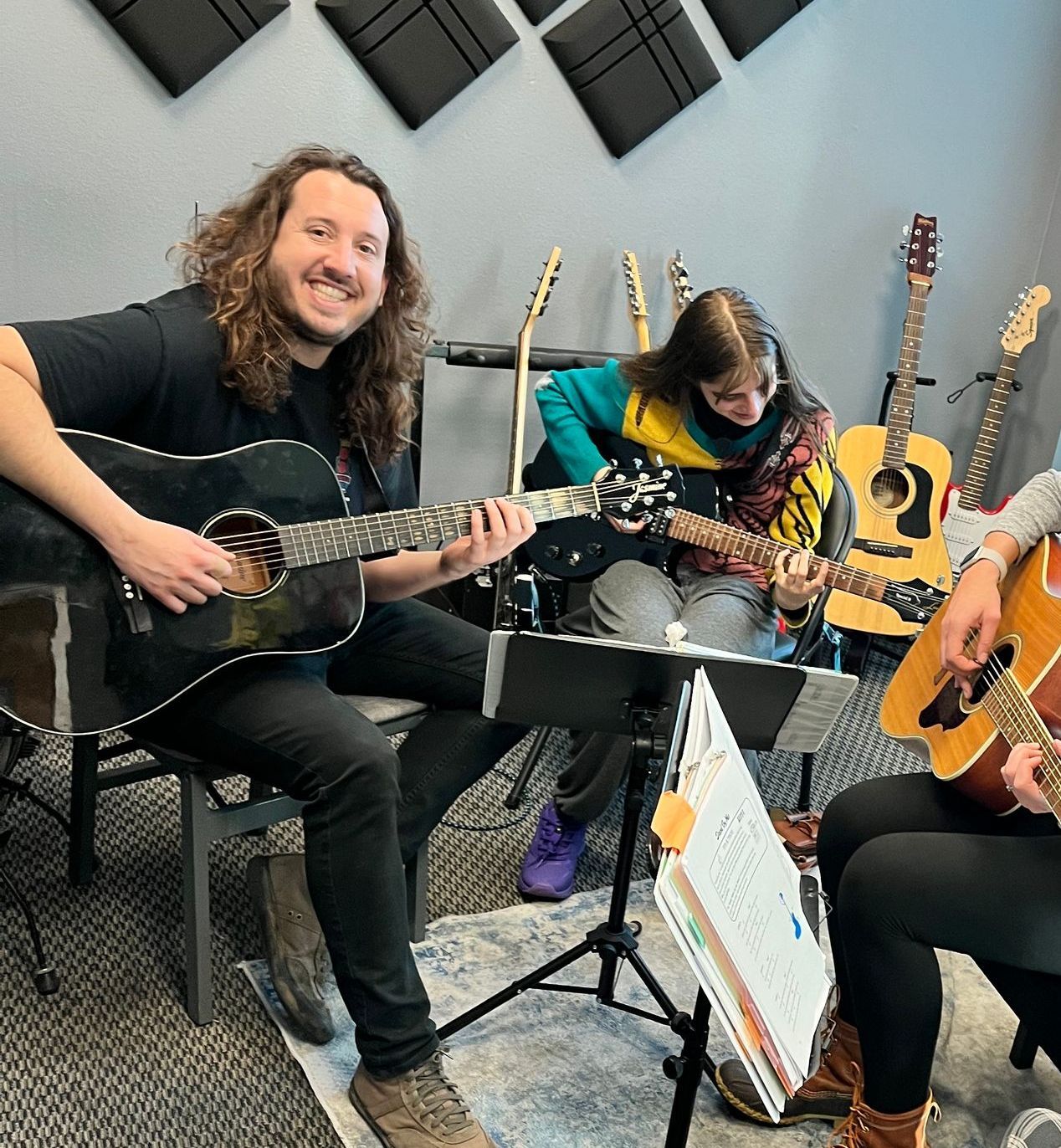guitar instructor and class