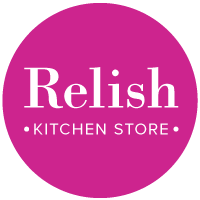 Pink circular logo reading “Relish Kitchen Store” in white text.