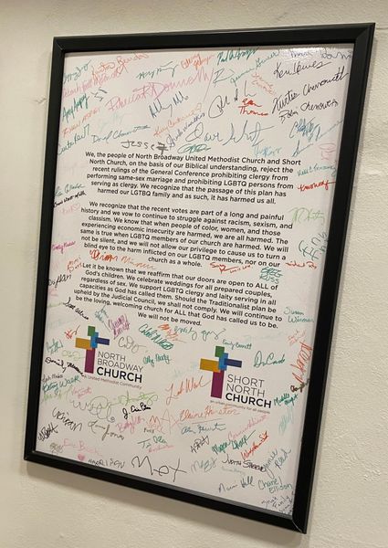 Short North Church is LGBTQ+ Affirming Church. Framed church certificate covered with colorful handwritten signatures and notes