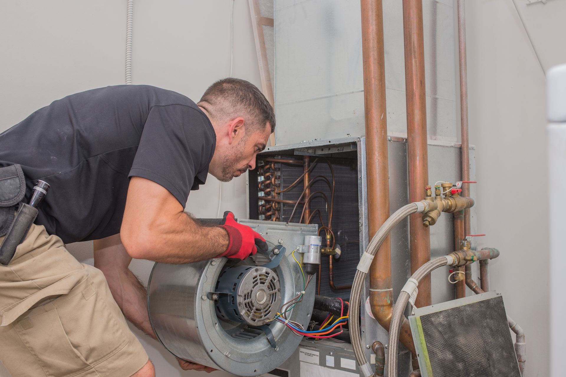 Hvac repair technician removing a blower motor from air handler | Cornelia, GA