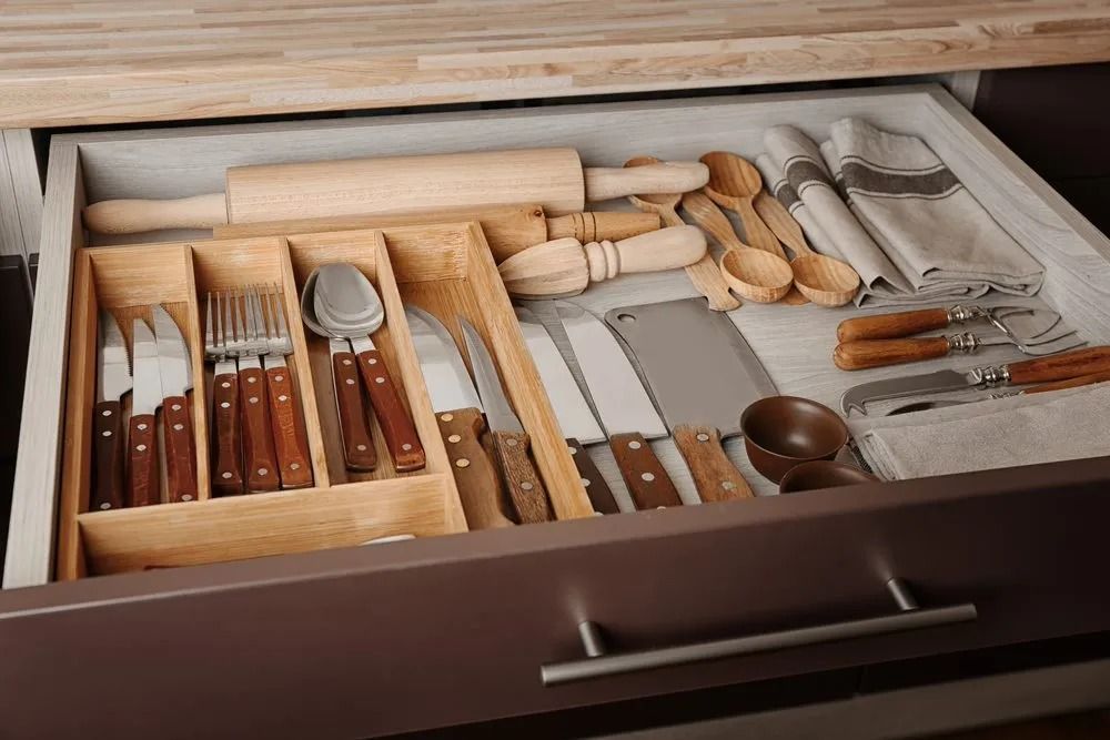 Open Kitchen Drawer With Organized Utensils — Jodi Maree Interiors in Dubbo, NSW
