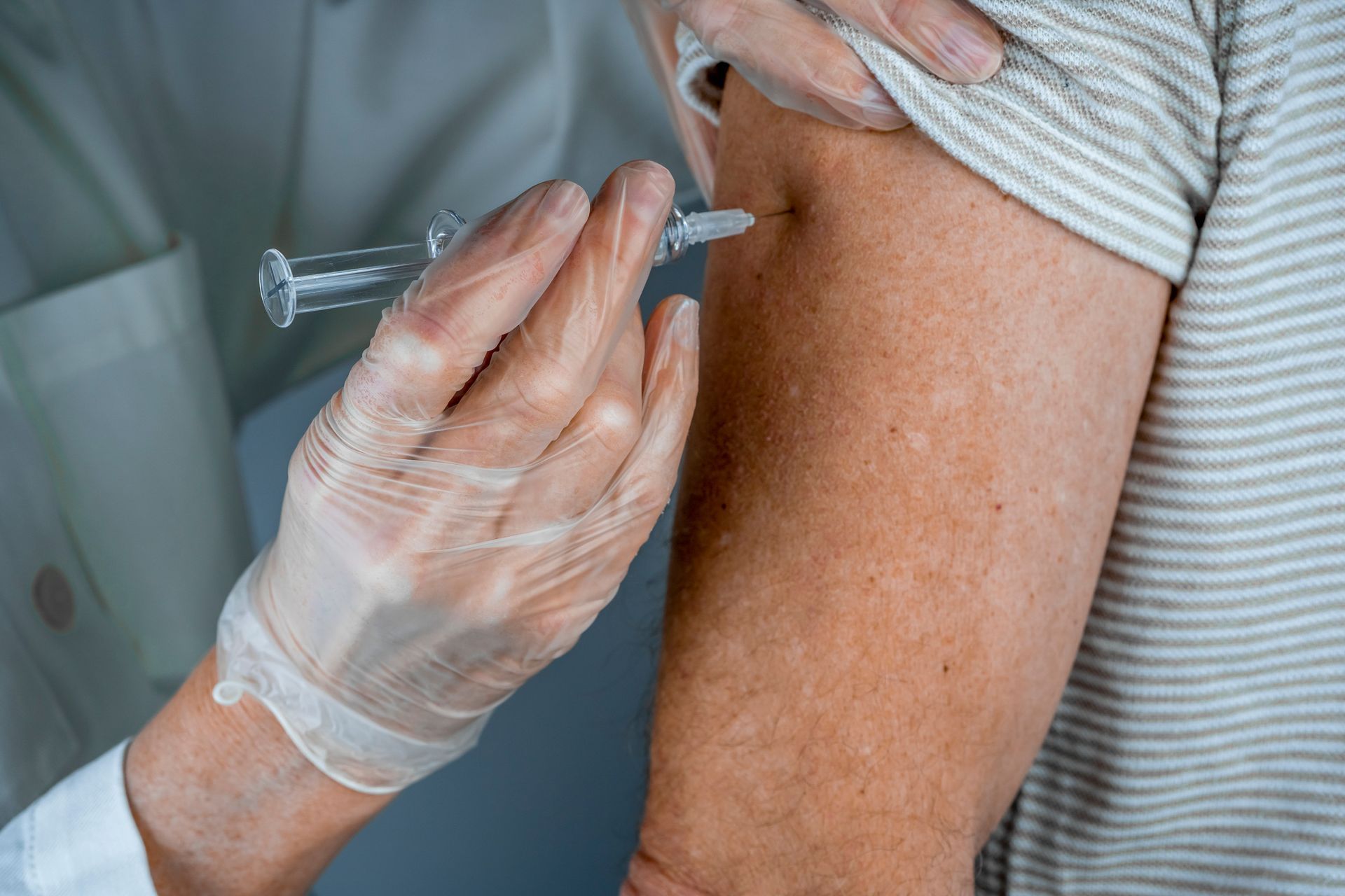 Flu vaccination in Ashford administered by healthcare professional in clinic