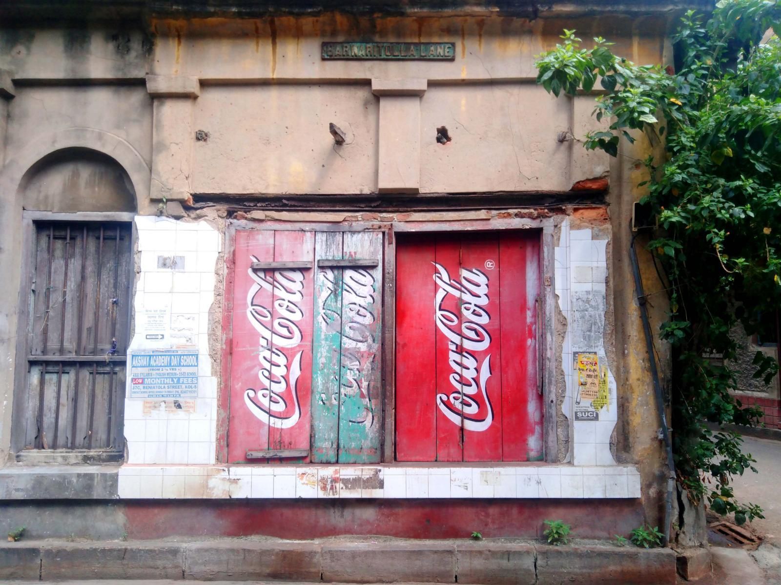 alte Coca Cola Werbung in Kalkutta