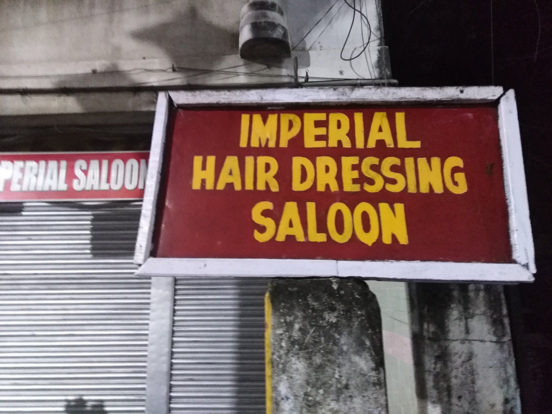 Ladenschild handgemalt imperial hair dressing saloon Kalkutta Frisör