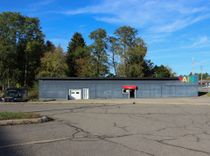 A single-story gray commercial building with a 