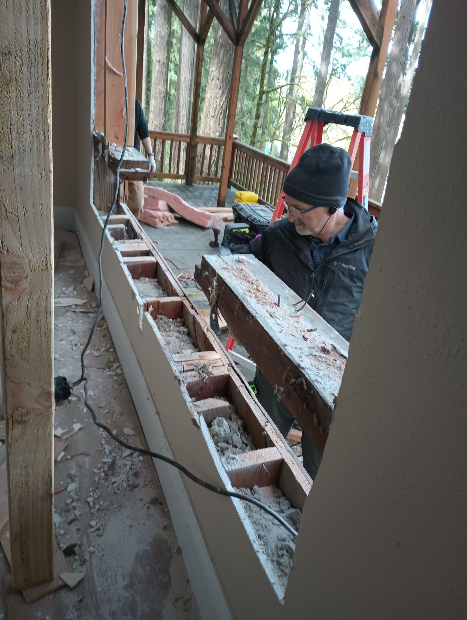 Cutting out old windows prior to installing new windows in Portland, OR. My Window Man