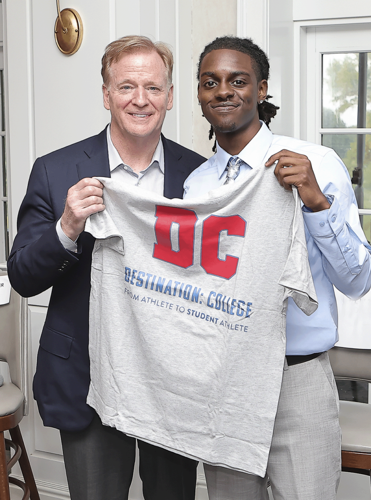 NFL Commissioner Roger Goodell is presented with a t.shirt designed and created by a Destination: College 2025 Cooney Scholarship awardee at the 2025 Best Night of The Year event.