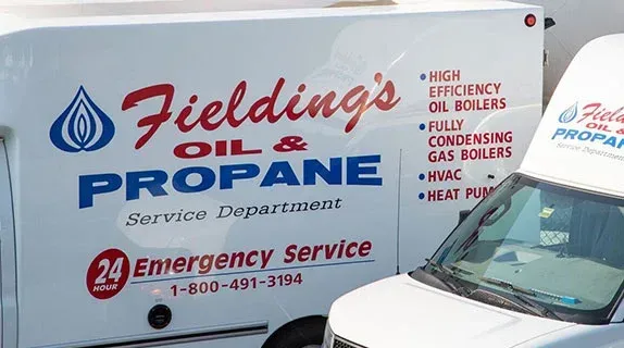 Fieldings Oil & Propane service truck with company logo and phone number parked outside