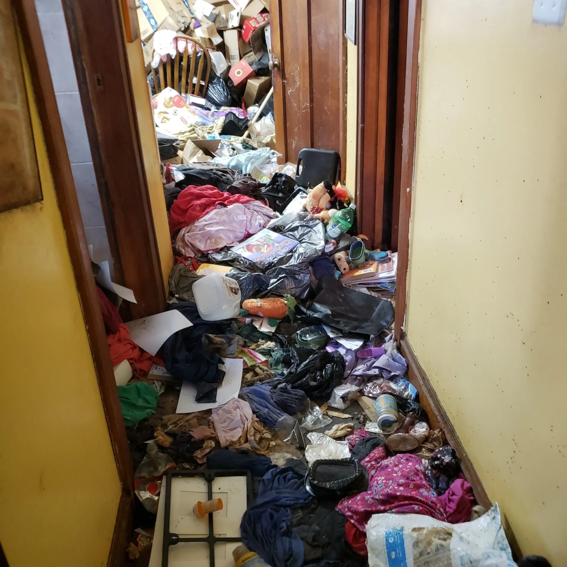 Corridor With Junks — Chicago, Suburbs, & Northwest Indiana — All Clear Clean Out & Junk Removal Services