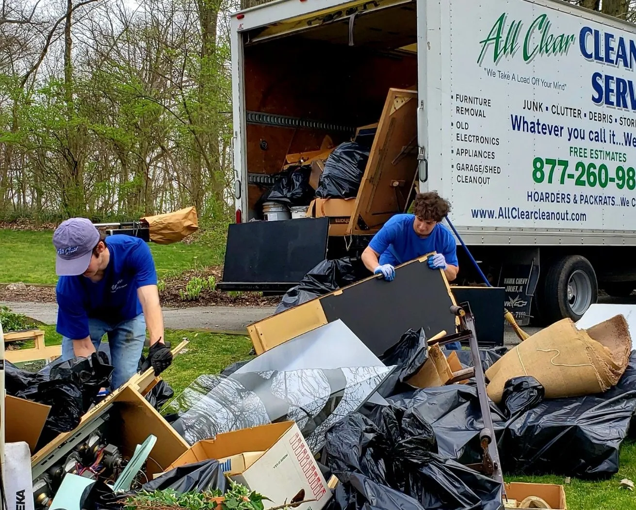 Putting Junks On A Large Truck — Chicago, Suburbs, & Northwest Indiana — All Clear Clean Out & Junk Removal Services