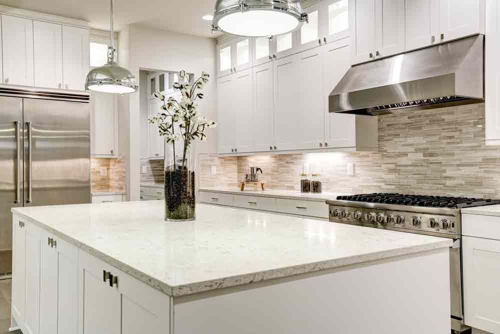 A Kitchen With White Cabinets
and Stainless Steel Appliances β Peterson Property Valuations In Caloundra West, QLD