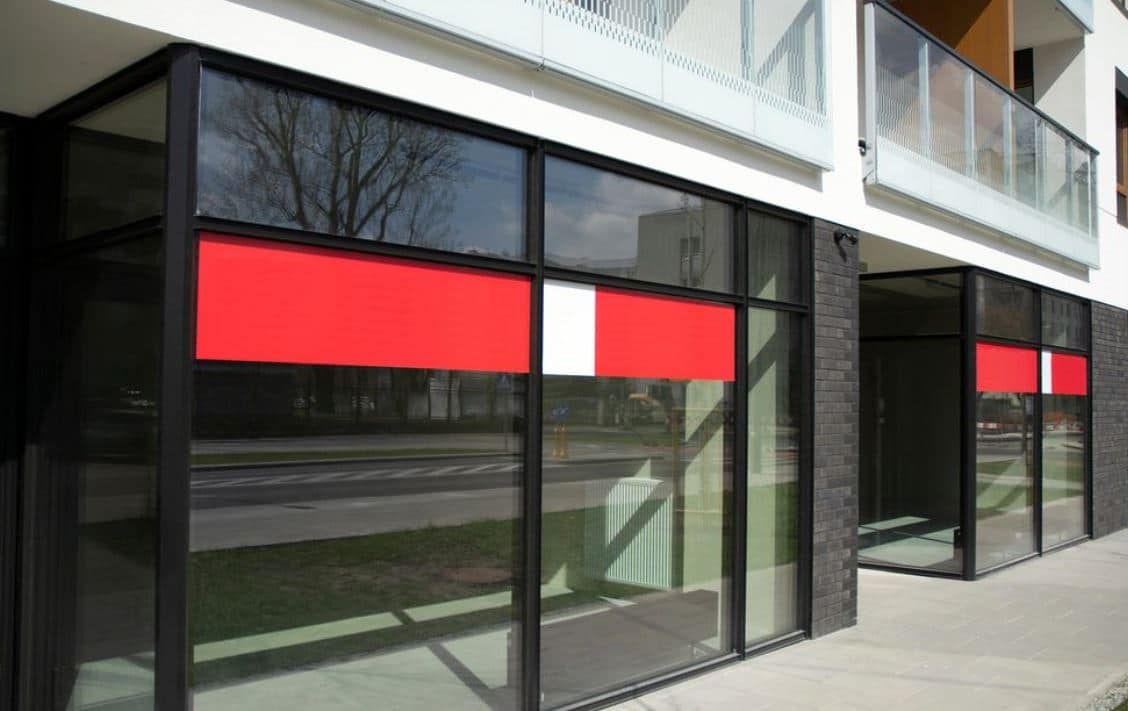 A Building With Red and White Stripes on the Windows β Peterson Property Valuations In Caloundra West, QLD