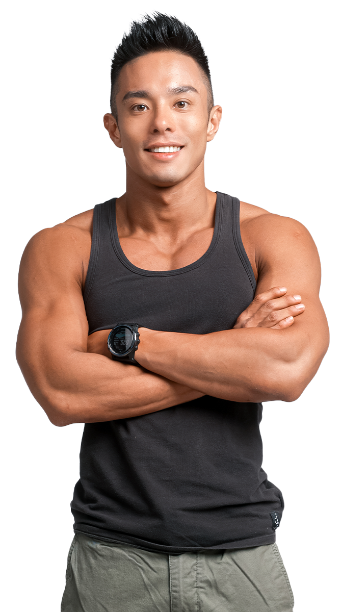 Andee Teo in a black tank top is standing with his arms crossed.