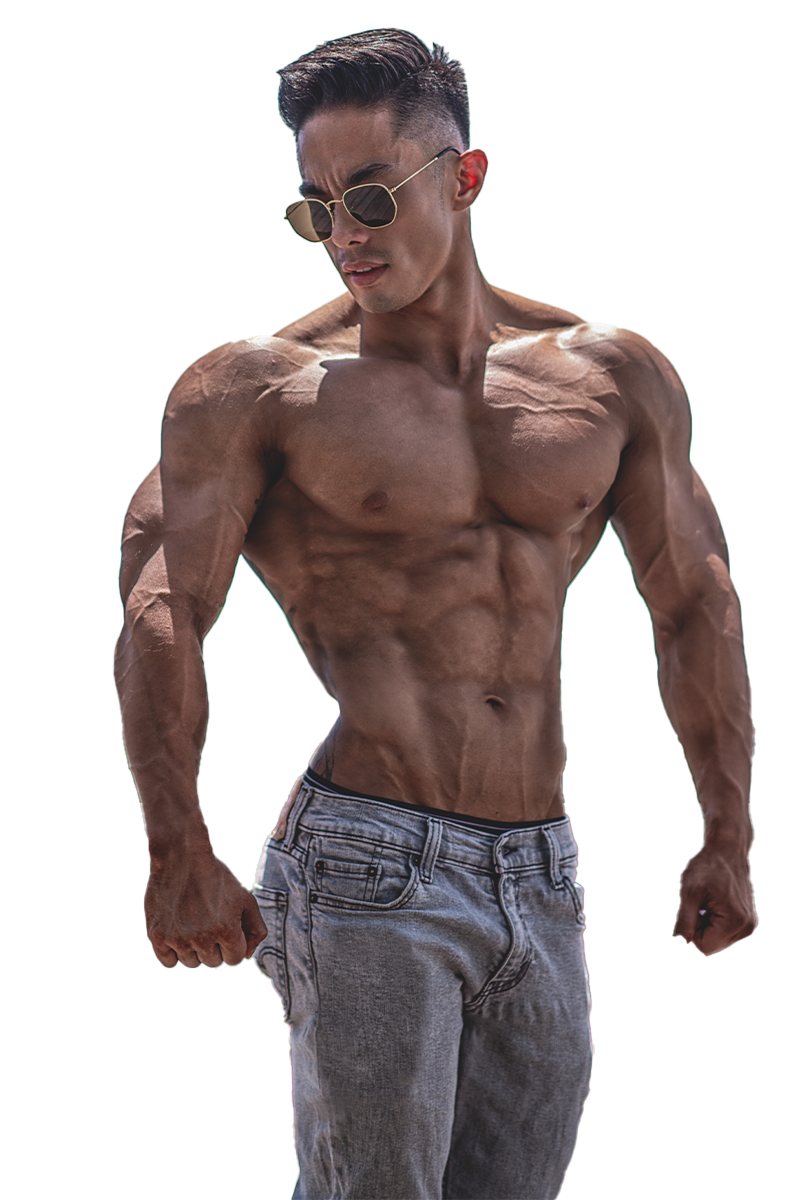Andee Teo with tattoos on his back is standing with his hands on his hips