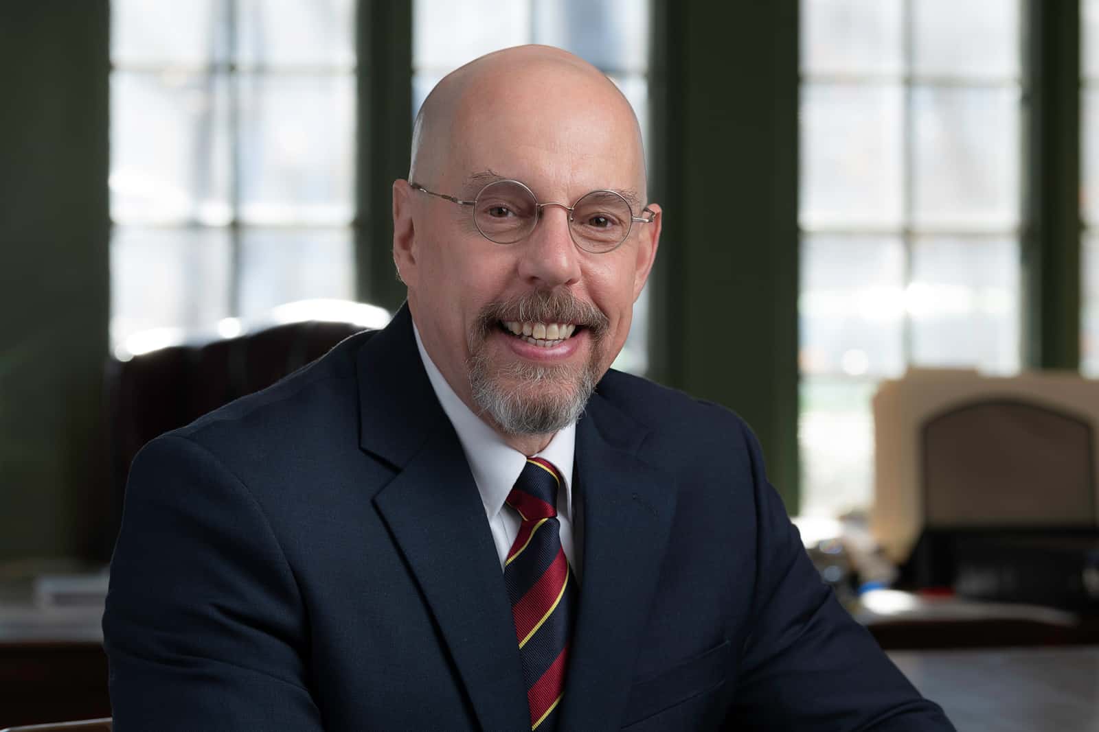 Anthony F. DiPadova Jr. in a suit and tie is smiling for the camera