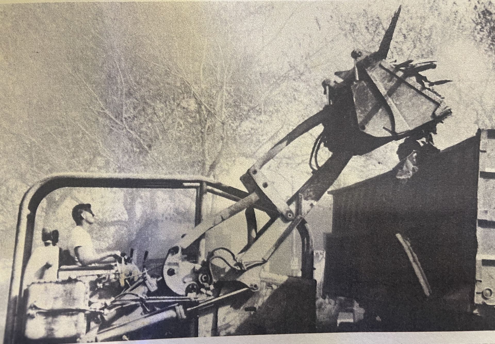 Black and White Photo of Man Driving a Machine— Chicago, IL — Sterling Holloway Demolition 