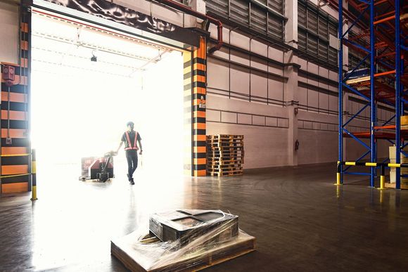 Workers Loading a Pallet by Hand Truck — Austin, TX  — Ghedi International