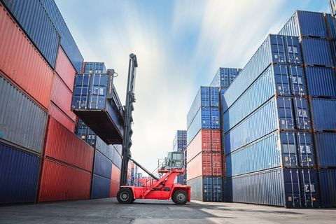 Transport Crane Forklift is Lifting Box Containers — Austin, TX — Ghedi International Transport Crane Forklift is Lifting Box Containers — Austin, TX — Ghedi International
