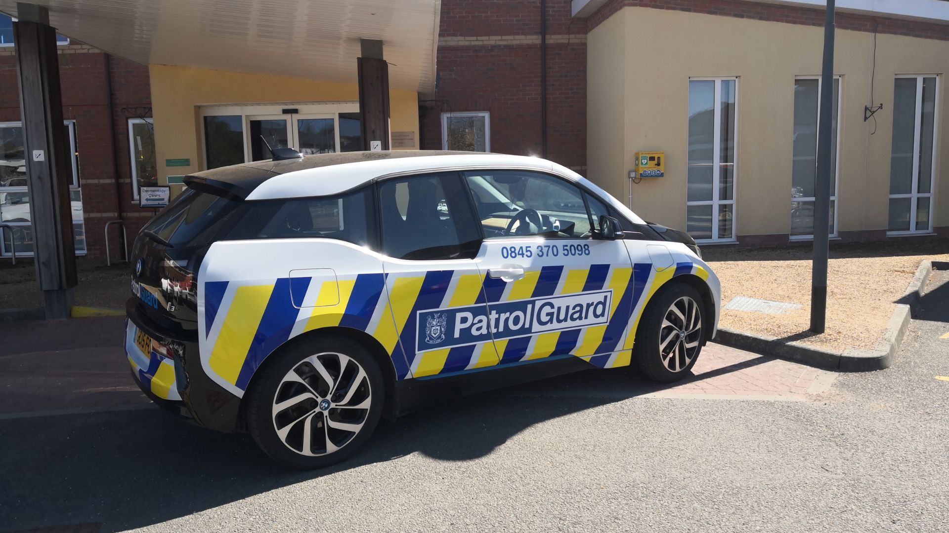 A PatrolGuard vehicle parked outside business premises.