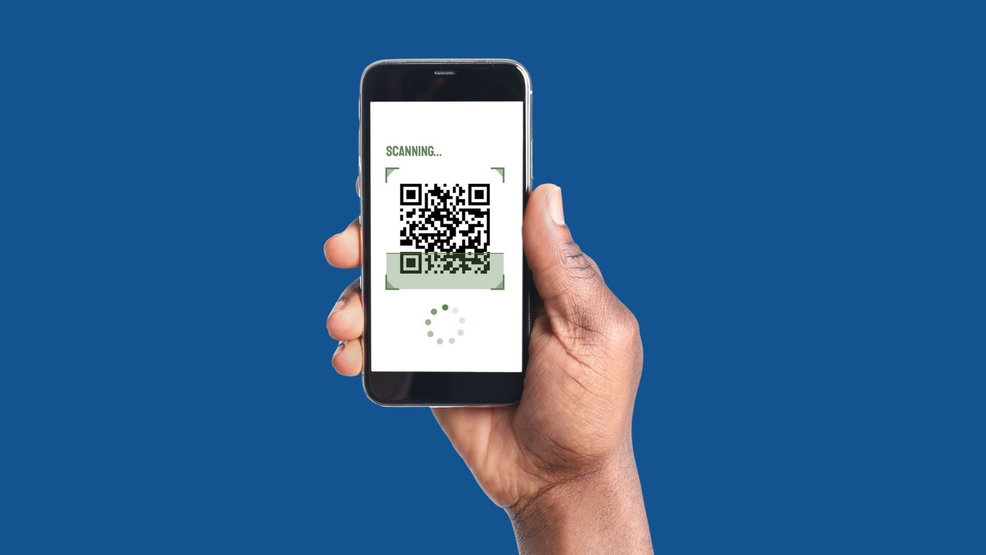 A hand holding an iPhone showing a QR code with the text ‘Scanning’ above it and a circular loading symbol below it.