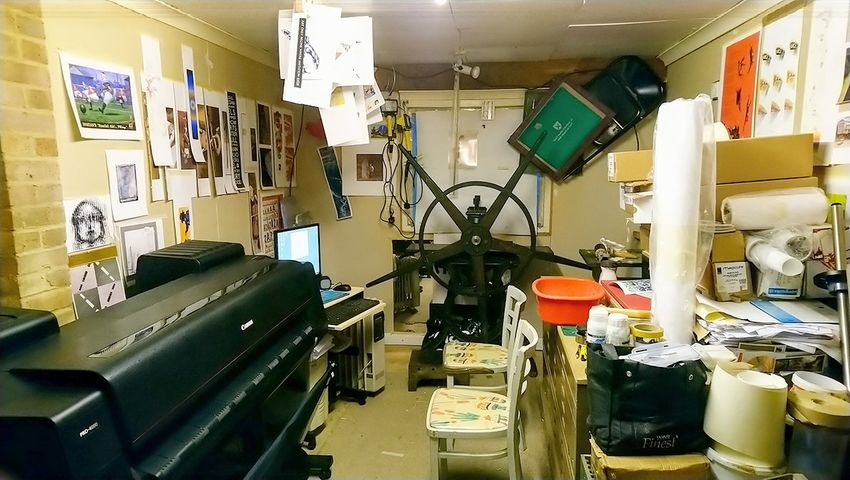 Picture of giclee printing workshop showing Canon Pro 4000 and star wheel etching press