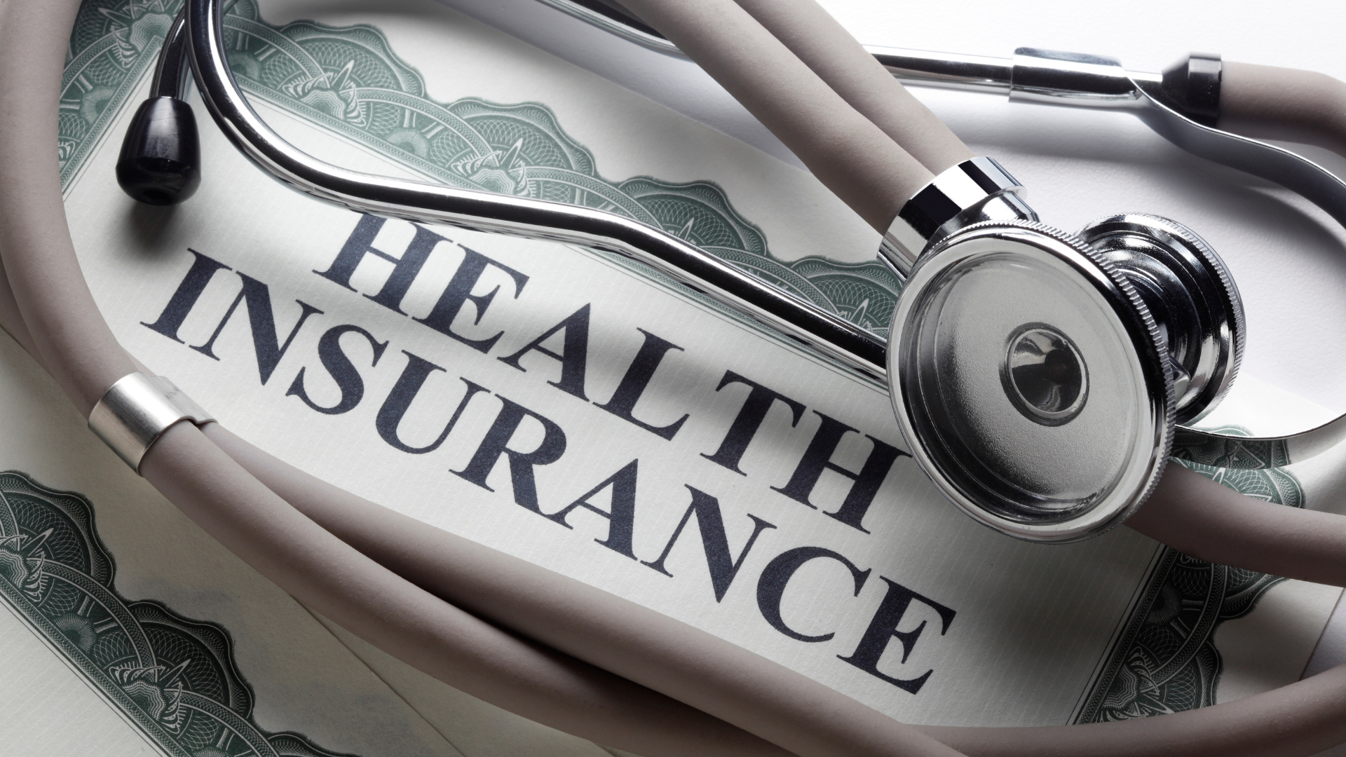 Stethoscope draped over a document with
