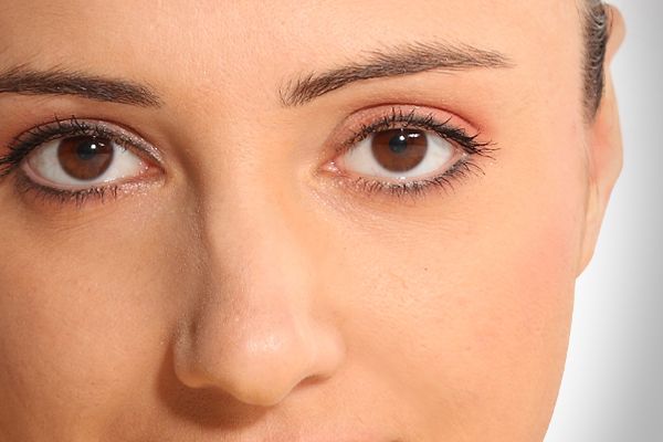 A close up of a woman 's eyes and nose.