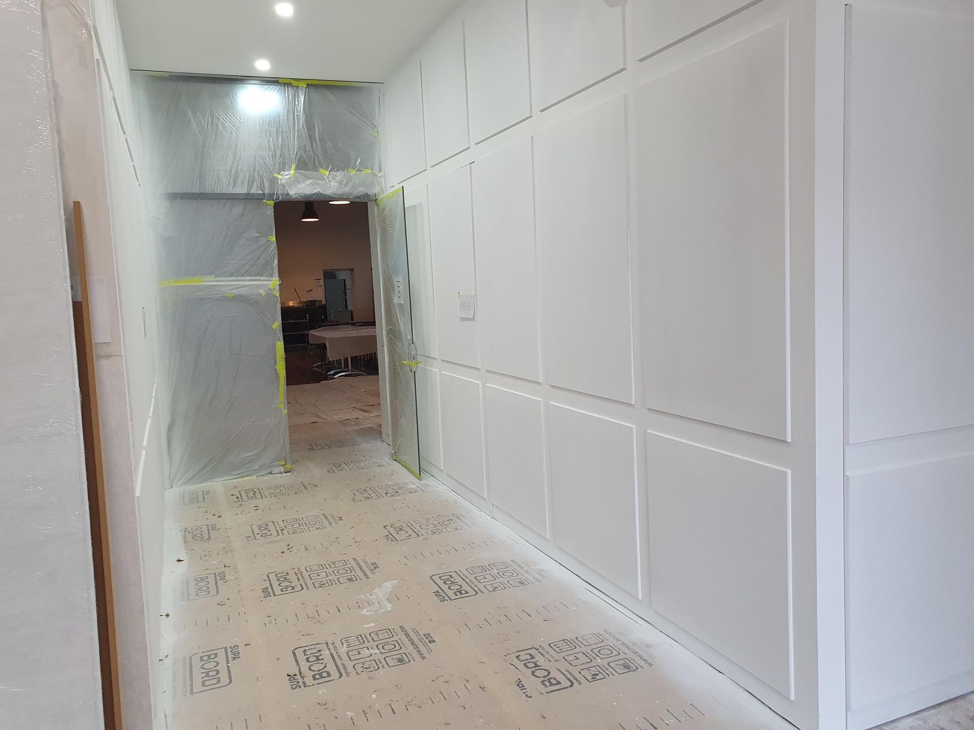 A Room Is Being Remodeled with Drywall and A Scaffolding — Mezcon Renovations & Maintenance in Bulleen, VIC