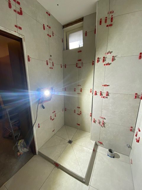 Bathroom with tiled walls and floor, using tile leveling system — Mezcon Renovations & Maintenance in Heidelberg, VIC