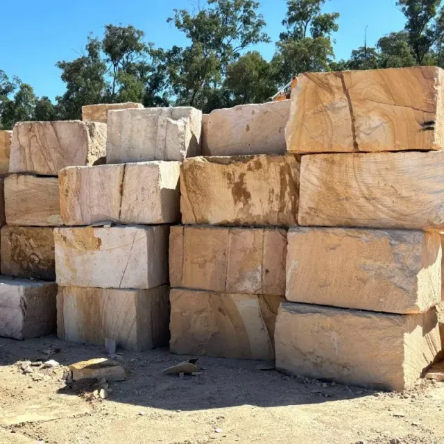 A bunch of sandstone bricks are stacked on top of each other