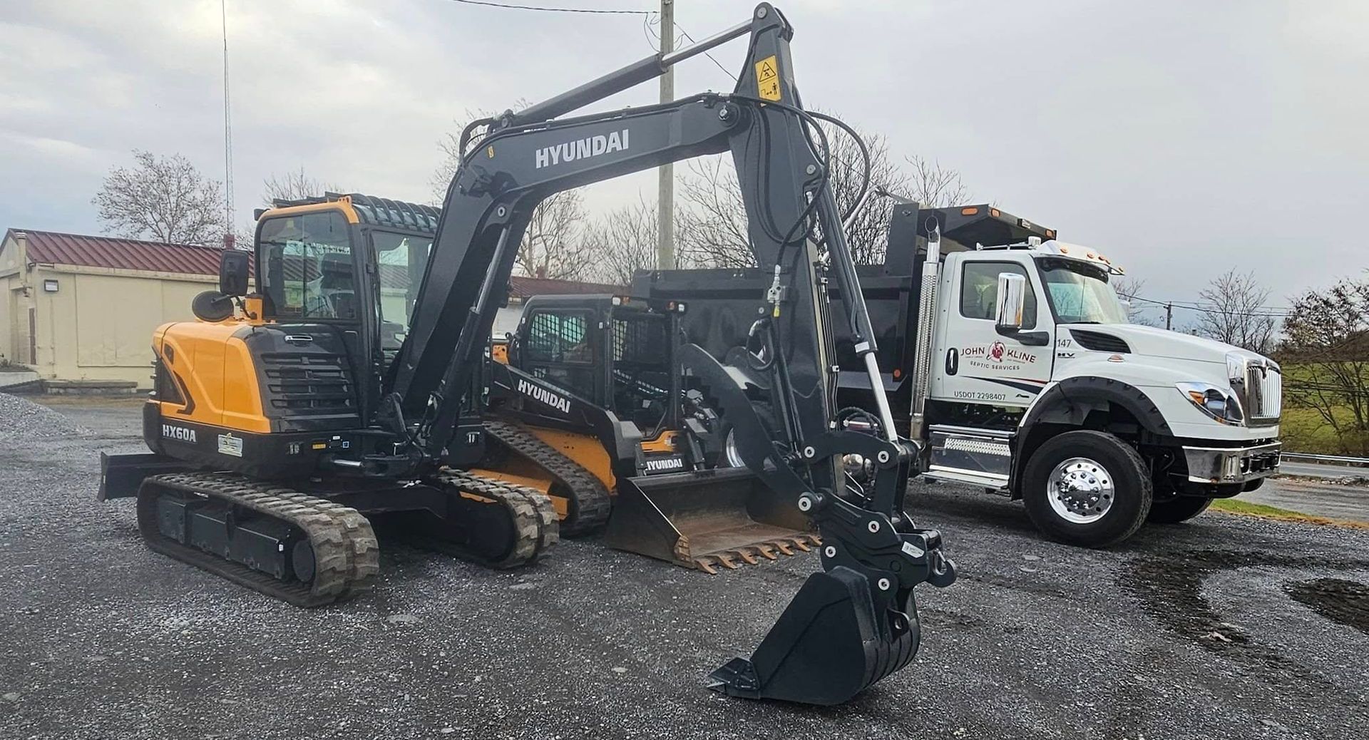 John Kline Septic Services Skid Steer, Dump Truck and Excavating equipment