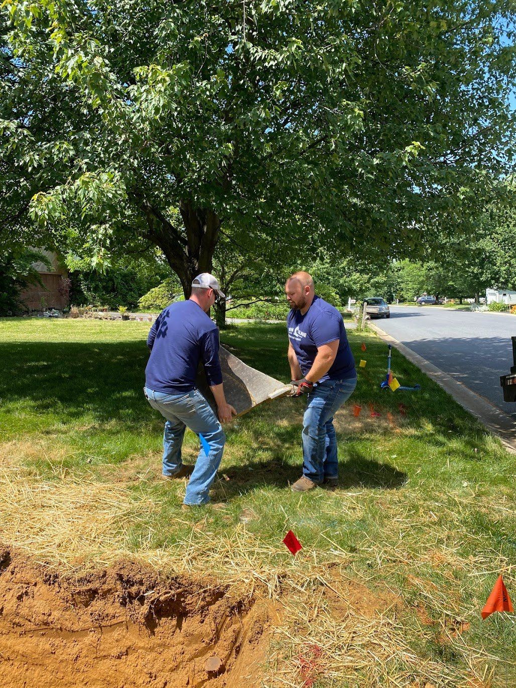 John Kline Septic Team members handling parts for septic repair services Manheim Township PA