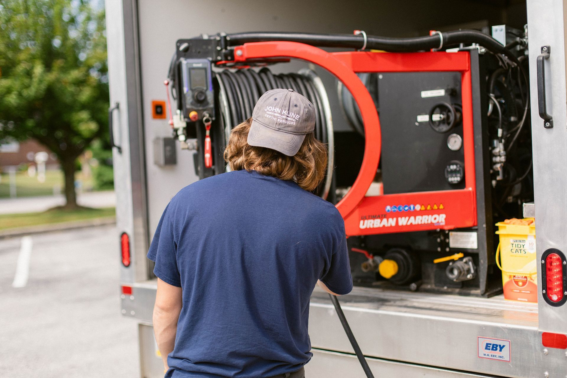 septic plumbing technician working with line opening equipment in Lancaster, PA