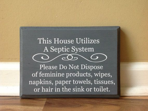 A sign that says this house utilizes a septic system