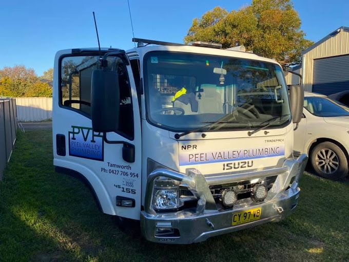 A Person is Installing a Hose in the Ground — Peel Valley Plumbing In Hillvue, NSW