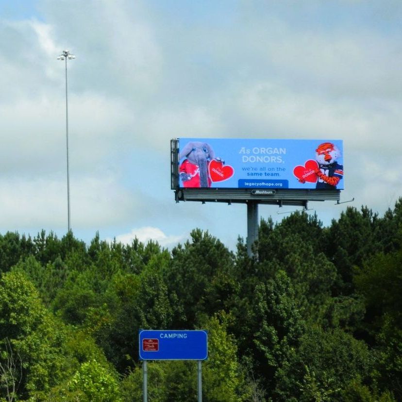 a highway with a billboard on the side of it