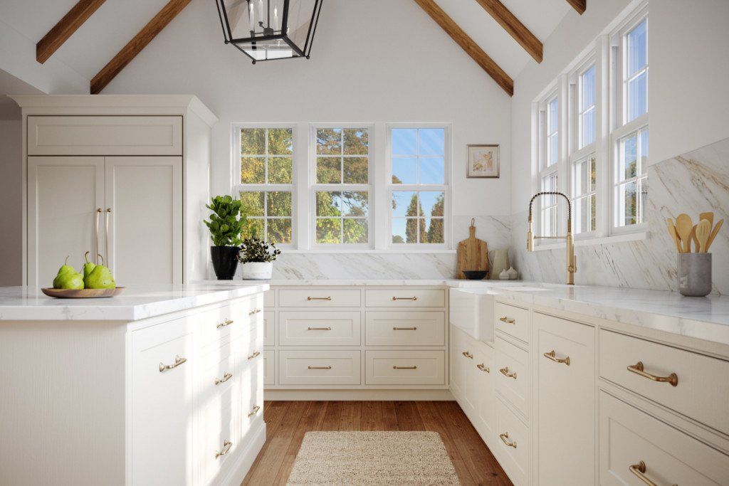 A kitchen with white cabinets and a vaulted ceiling