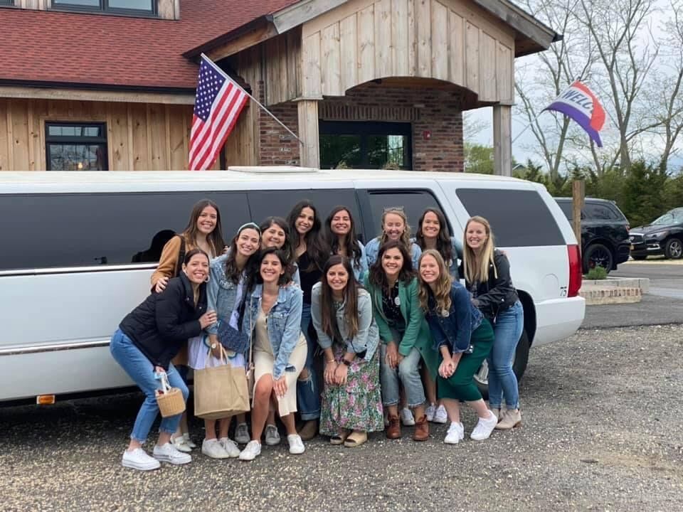 East End Wine Tasting Tour's Bachelorette Group posing at Sannino Vineyard Entrance
