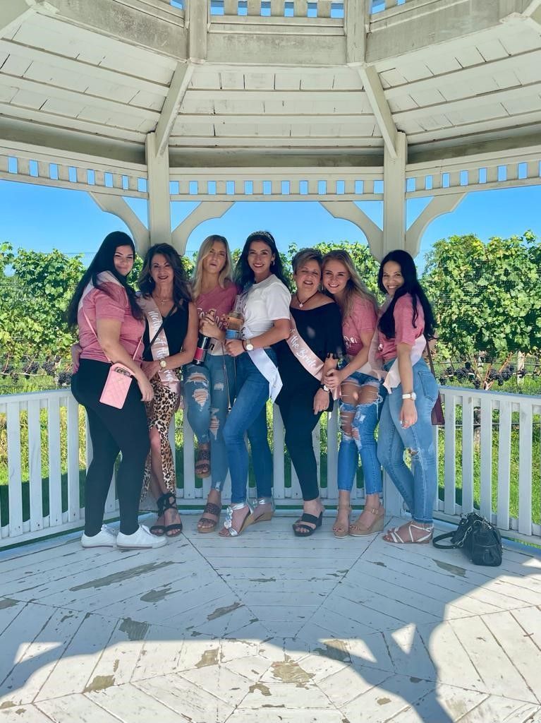 Bachelorette Group from NYC posing in Pellegrini Vineyard Pergolar