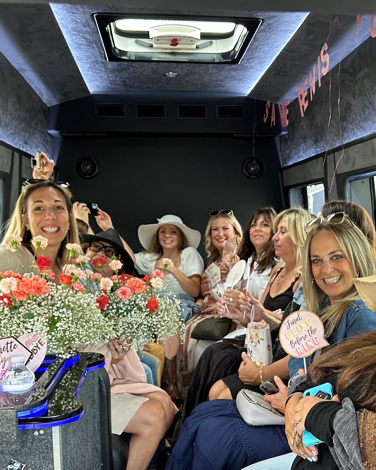 Bachelorette Group posing inside one of East End Wine Tasting Tours' Party Style Vans