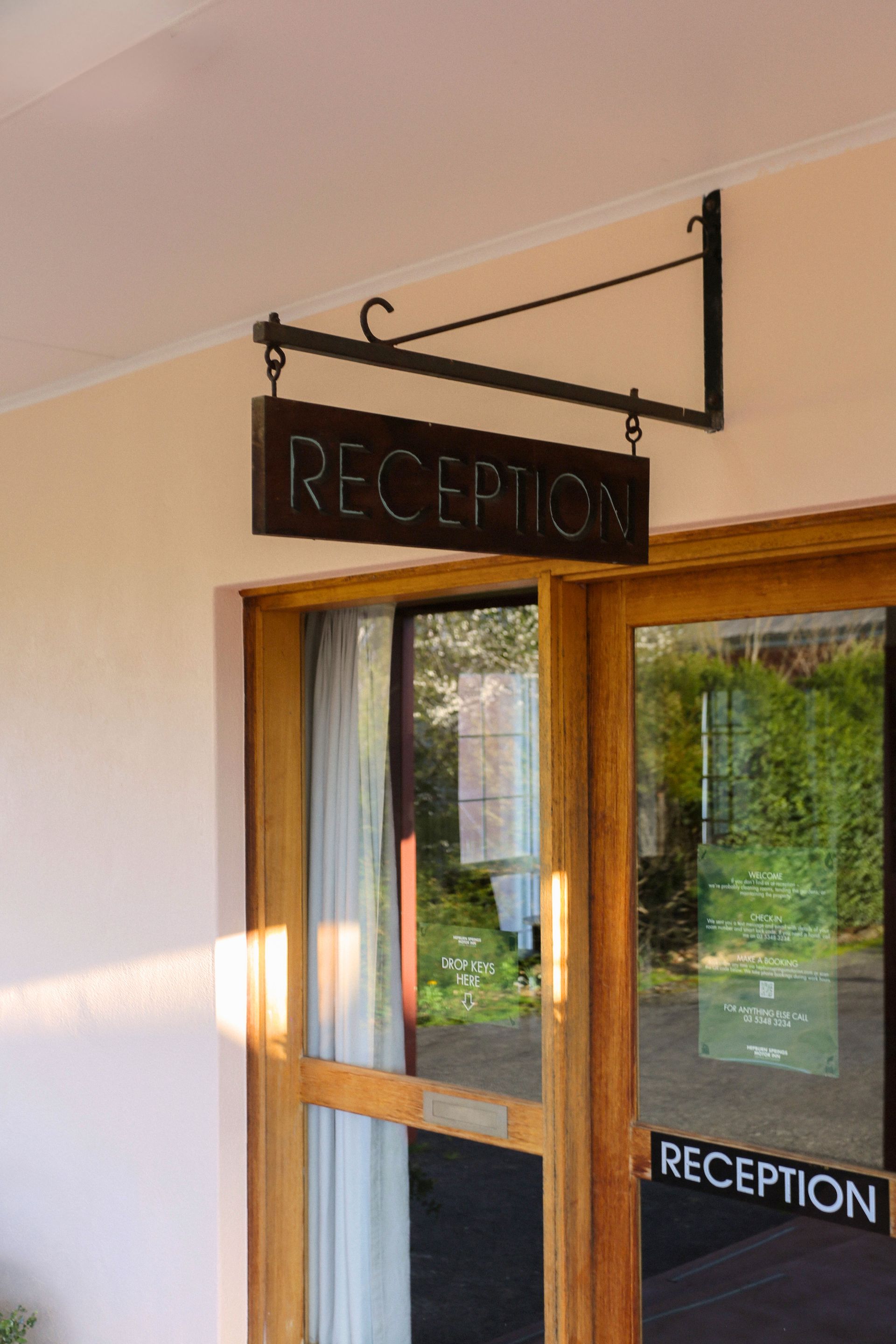 Sign above wooden door: 