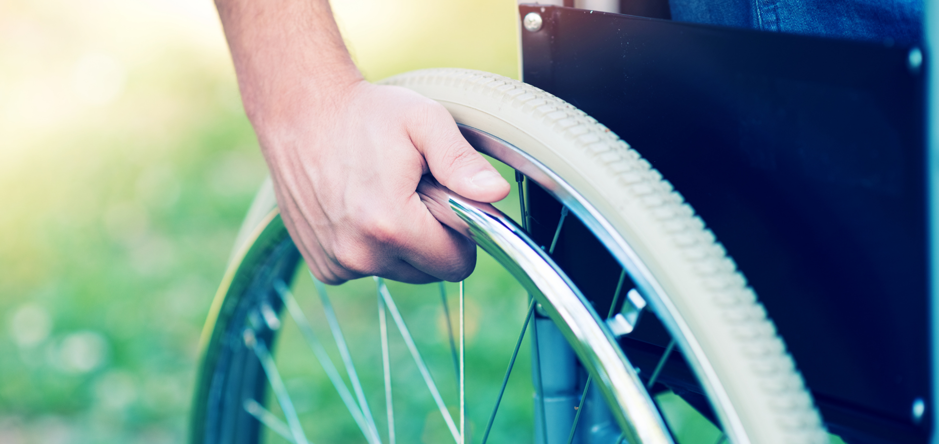 hand on wheelchair