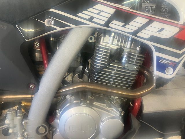 A close up of the engine of a dirt bike