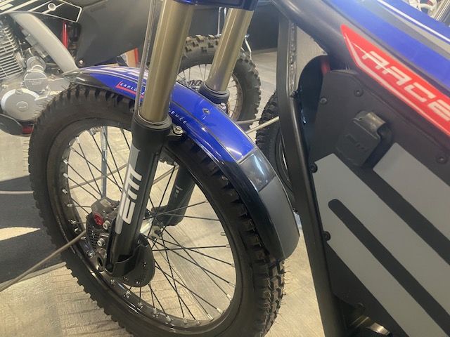 A race motorcycle is parked in a garage