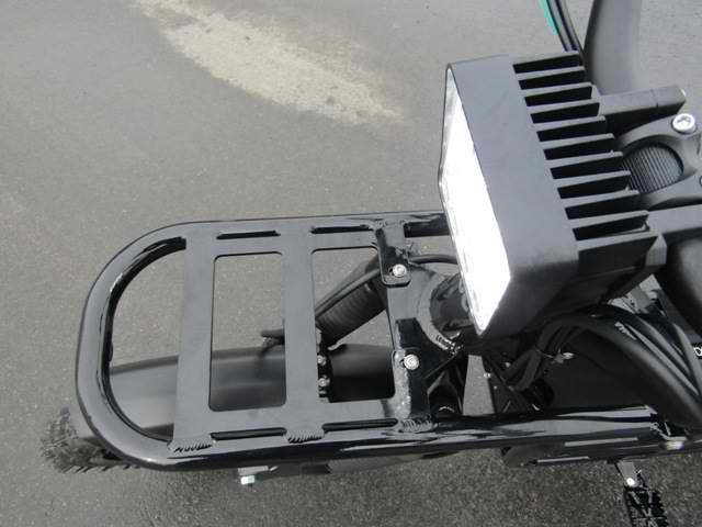 A black motorcycle with a light on the back