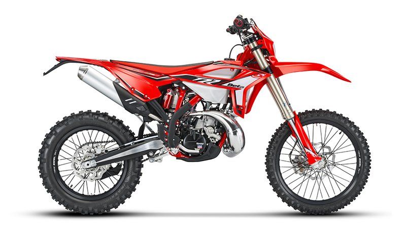 A red dirt bike is shown on a white background.