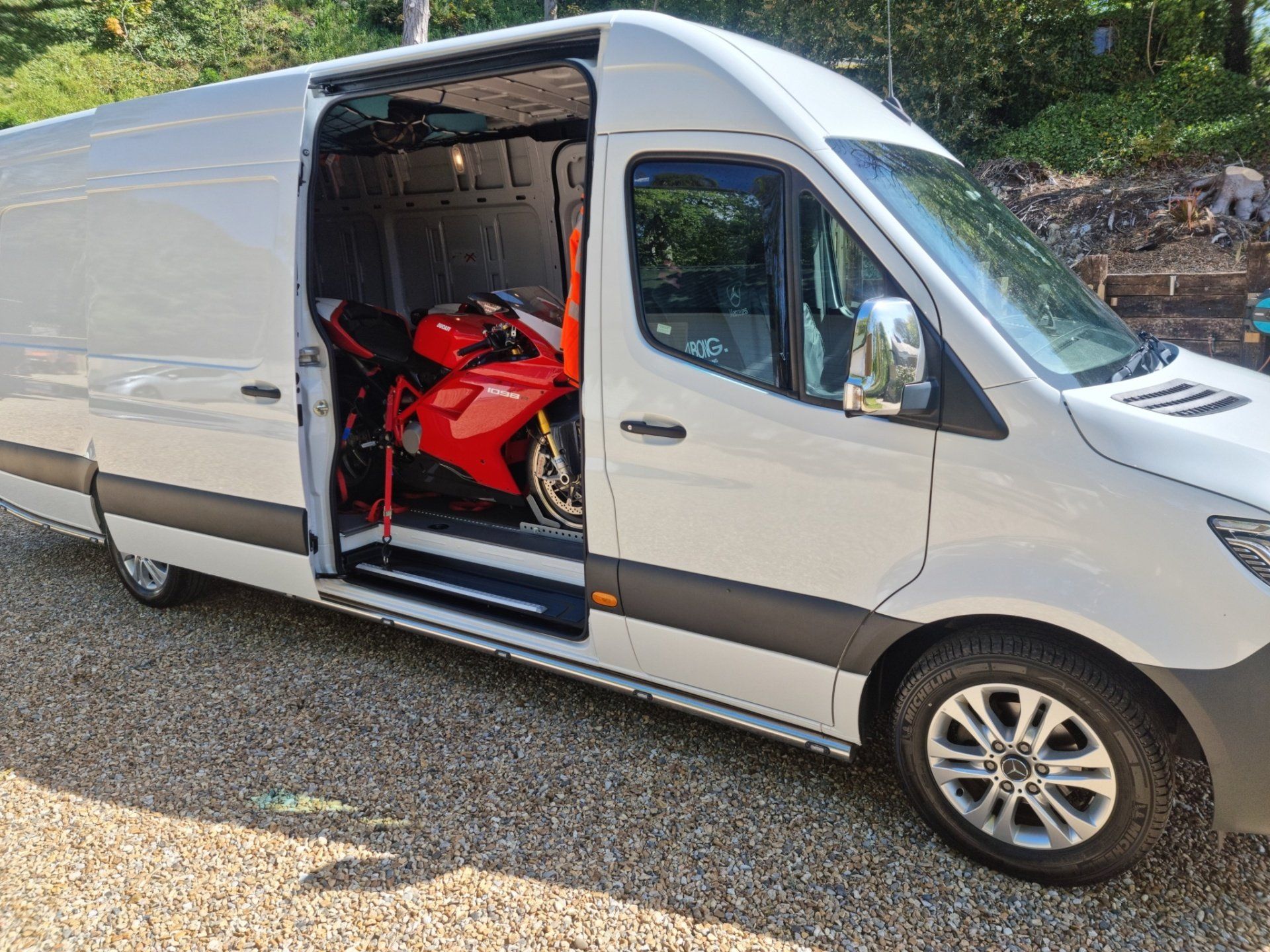 A Ducati motorcycle loaded in a Sprinter for transport by MTC Transport