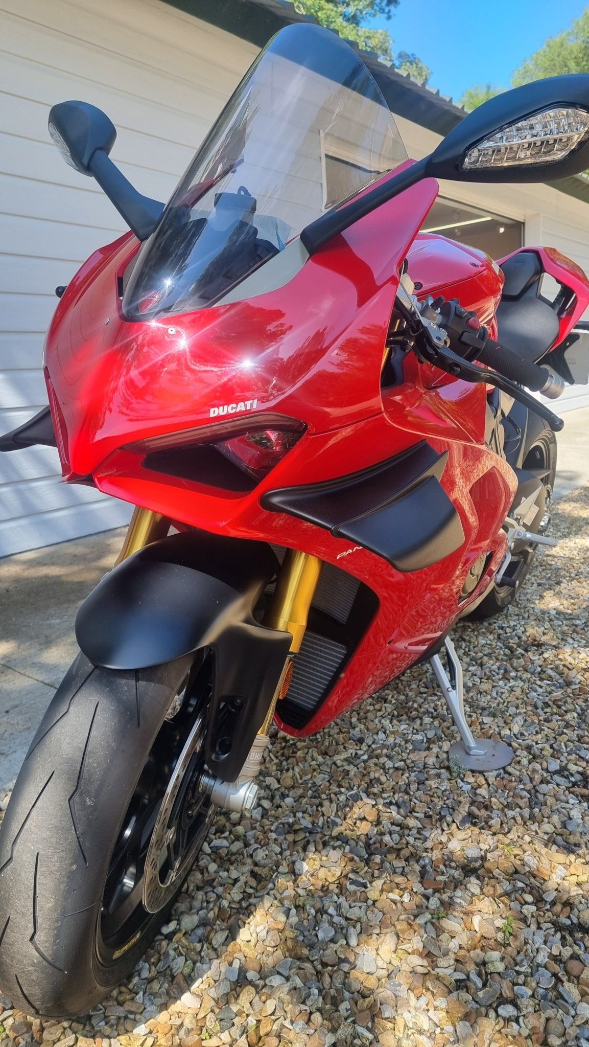 Red Ducati motorcycle parked on its side stand