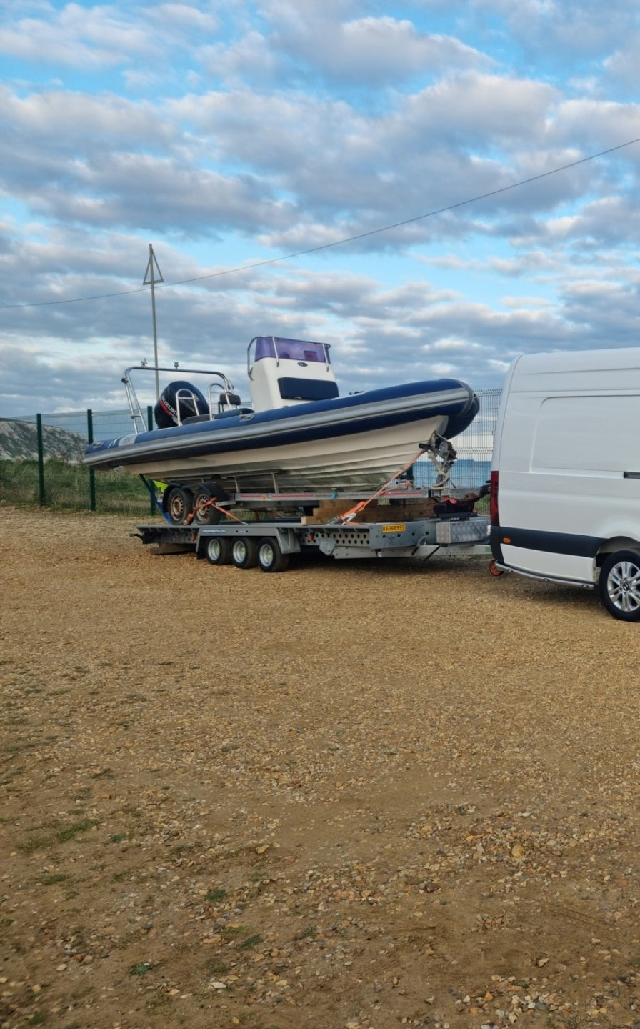 A boat & trailer loaded on a road trailer, ready for transport by MTC Transport